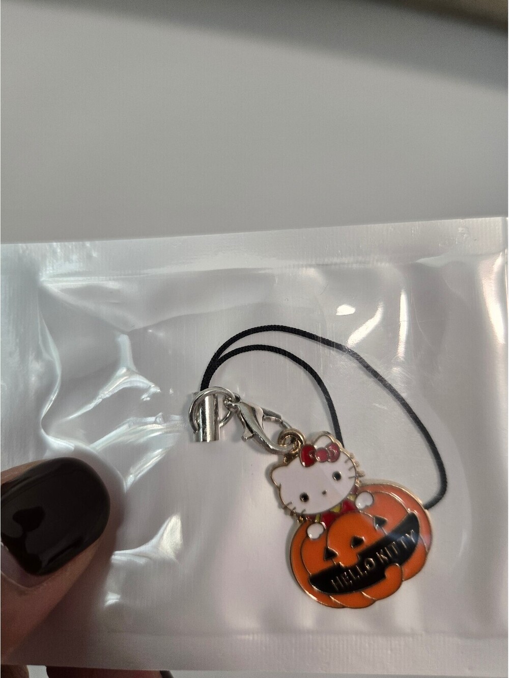 Hello Kitty pumpkin enamel phone charm